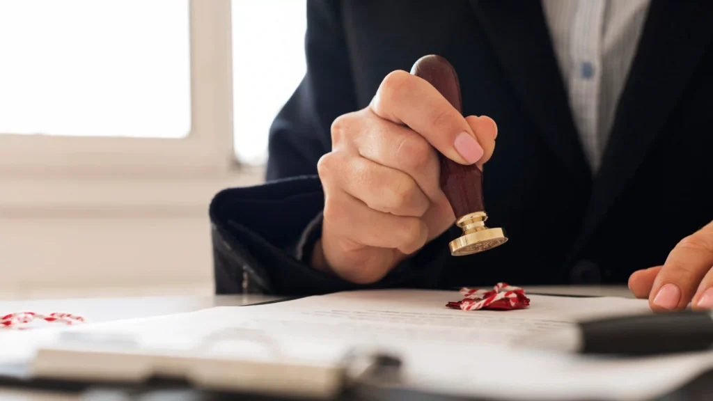Professional notary sealing official legal documents with wax stamp in UAE, symbolizing certified notary public services in Dubai, Abu Dhabi, Sharjah, and Ajman