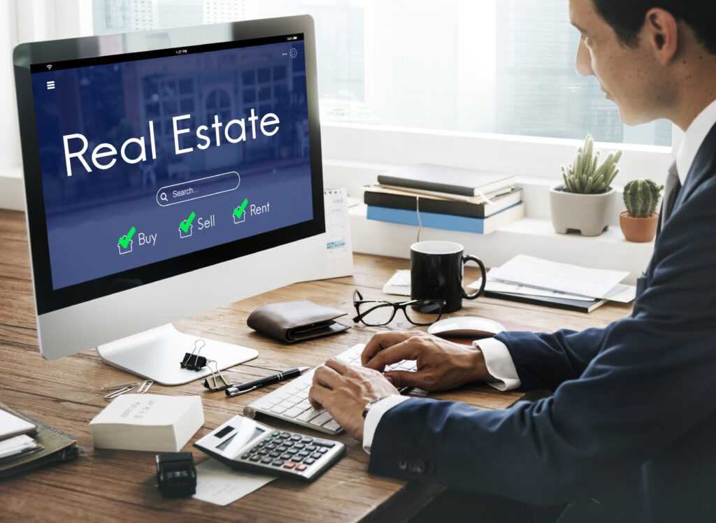 Business professional using online real estate platform for property search in UAE to buy, sell, or rent homes and commercial properties — digital property management and real estate investment solutions.